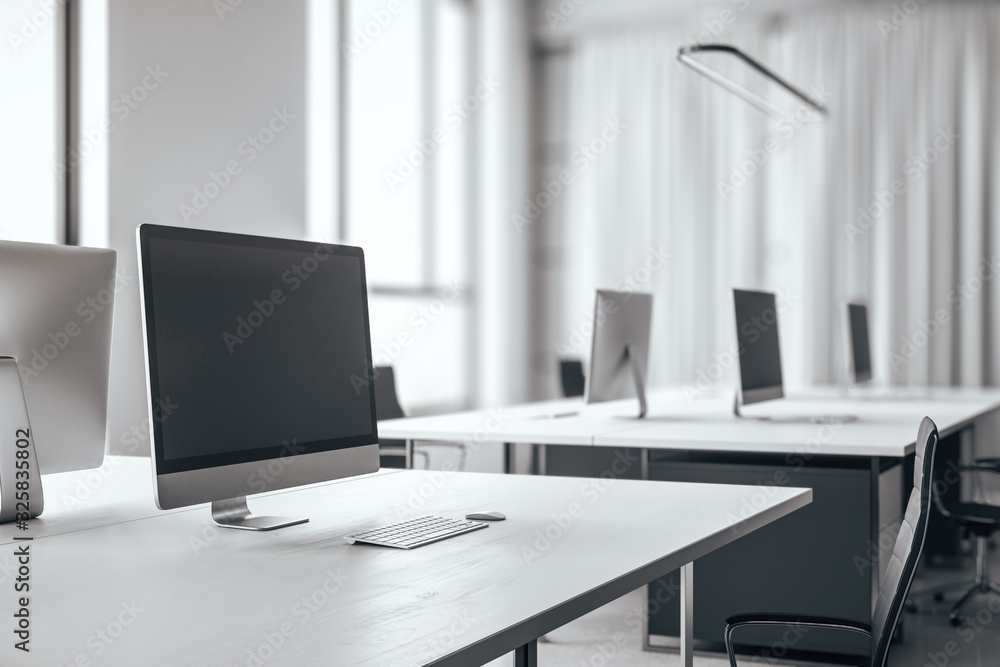 Modern designer desktop with empty computer screen Modern designer desktop with empty computer screen