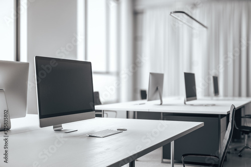 Modern designer desktop with empty computer screen