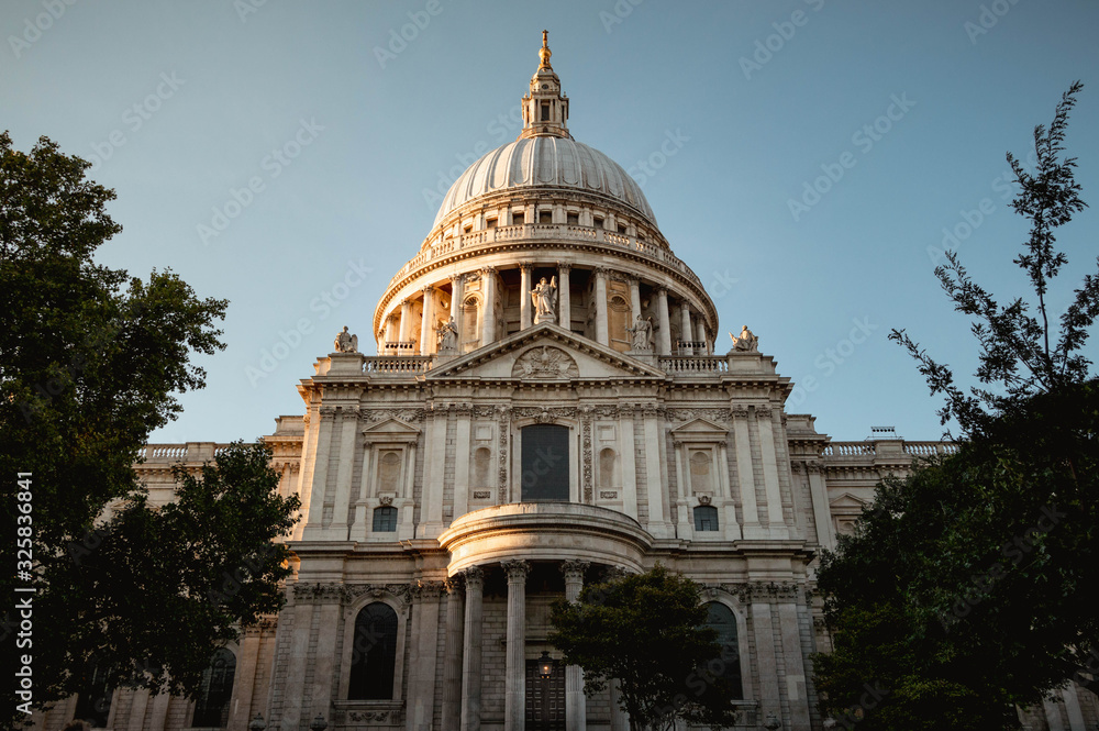 St Pauls Cathedral lit up in the sunset as evening draws in. This beautiful building is really shown off by the soft glow in this dusky scene. 