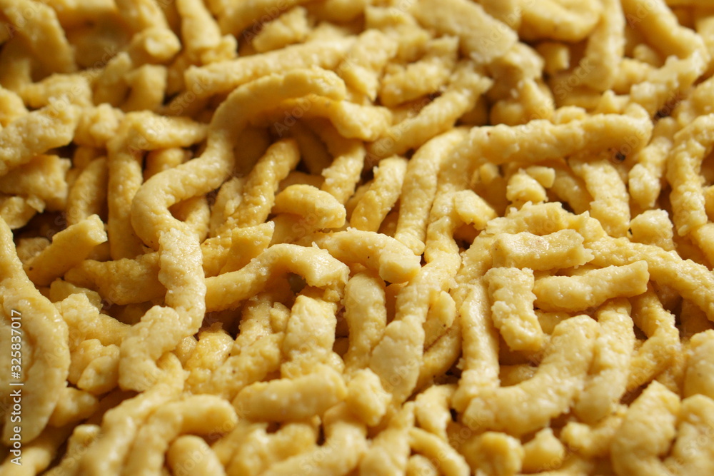 a pile of homemade swabian spaetzle pasta noodles a pile of homemade swabian spaetzle pasta noodles
