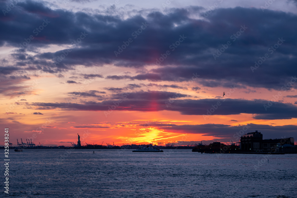 Winter Sunset view of Statue of Liberty and Upper New York Bay