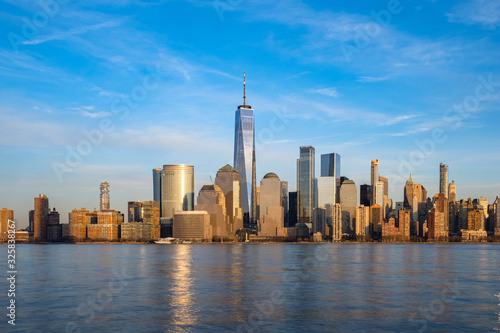 Daylight view of  Clouds Moving Over Buildings in Lower Manhattan Financial District Hudson River