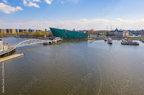 Aerial view of the Nemo Science Museum. The building is in the form of a green ship. Nemo was designed and renowned by Italian architect Renzo Piano. photo