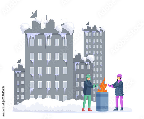 Frozen girl and boy warming his hands next to garbage barrel with snow covered city on background.
