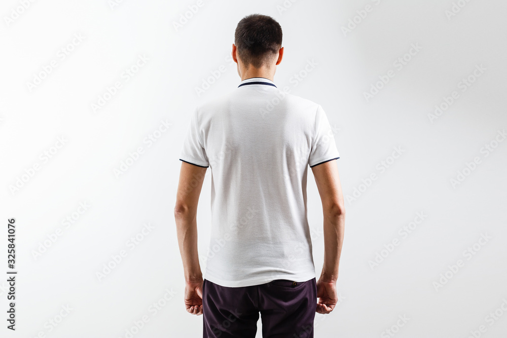 White t-shirt on a young man template on gray background White t-shirt on a young man template on gray background