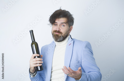 Surprised drunken dude in business blue suit. photo