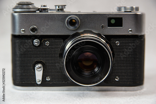 old camera with lens on a white background