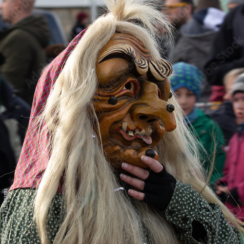 Closeup Portrait of a masked person on a carnival parade