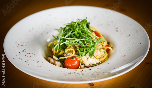 delicious fresh italian pasta with fish & rucola salad