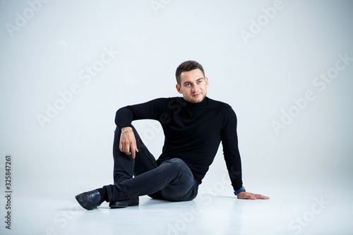 young businessman in black golf and jeans