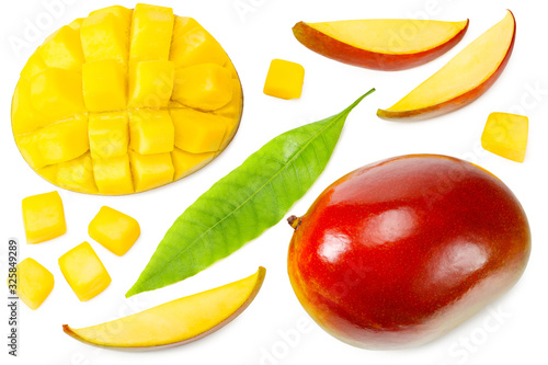 mango with slices and green leaves isolated on white background. healthy food. top view