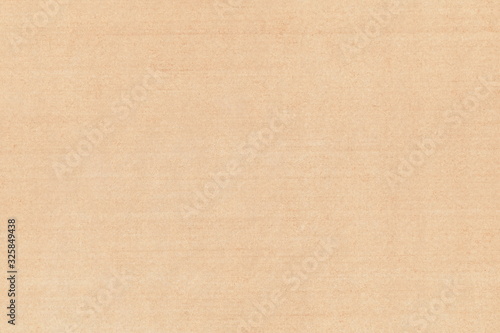 Vintage background of old yellowed paper. Grunge texture of aged brown book page with horizontal stripes and spots.