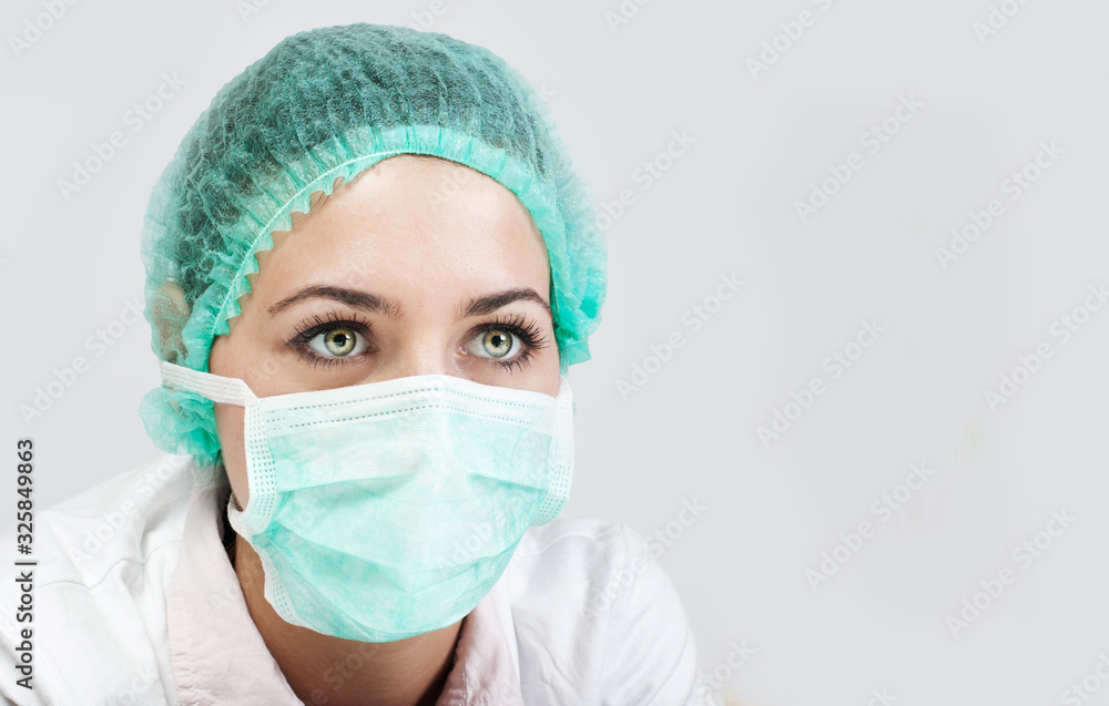 Woman doctor wearing a medical protective mask against coronavirus Woman doctor wearing a medical protective mask against coronavirus