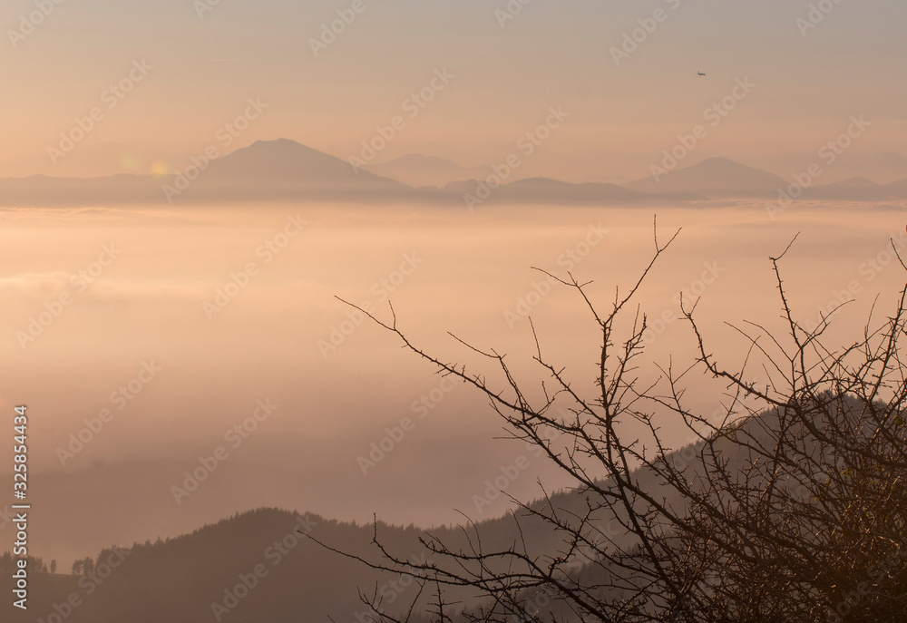 Fototapeta premium summit over a cloud sea in basque country, spain