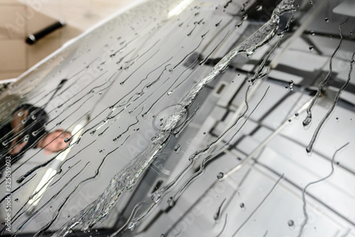 The Surface Protection of the car windows at the car wash under the jets of water