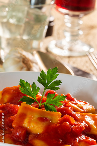 ravioli with tomato sauce on a plate photo