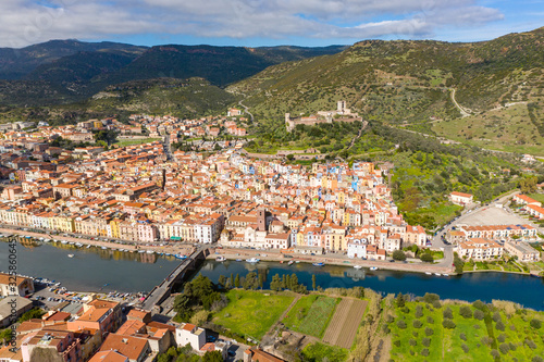 aerial view of bosa town with his colored houses and the castle in background