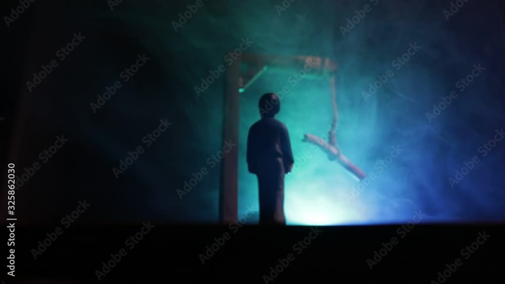 No smoking concept. Creative artwork table decoration with cigarettes. Cigarettes cause cancer and kill. Hanged cigarette on scaffold No smoking concept. Creative artwork table decoration with cigarettes. Cigarettes cause cancer and kill. Hanged cigarette on scaffold