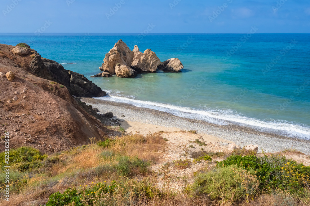 Cyprus. Aphrodite Bay. Petra Tou Romiou. Mediterranean sea. View from the shore on the rock of Aphrodite, view from the beach. Sea cliff. Pathos. Kuklia. The beaches in Cyprus.