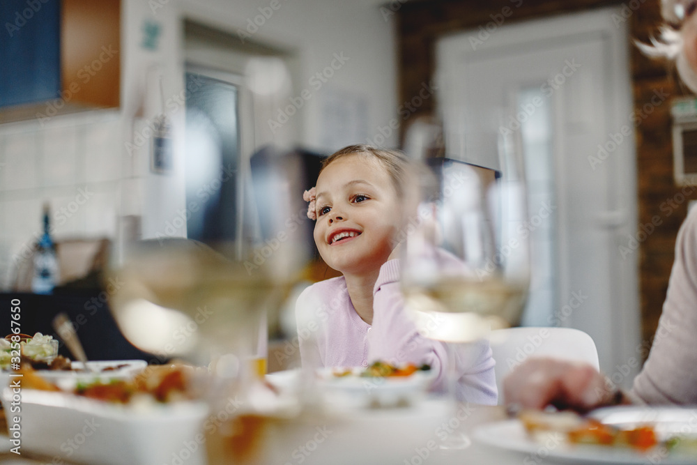 Cute little girl enjoying at dining table. Cute little girl enjoying at dining table.