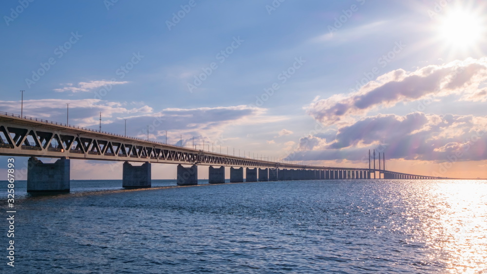 Famous Oresundbron, the Oresund bridge between Copenhagen in Denmark and Malmo in Sweden by day Famous Oresundbron, the Oresund bridge between Copenhagen in Denmark and Malmo in Sweden by day
