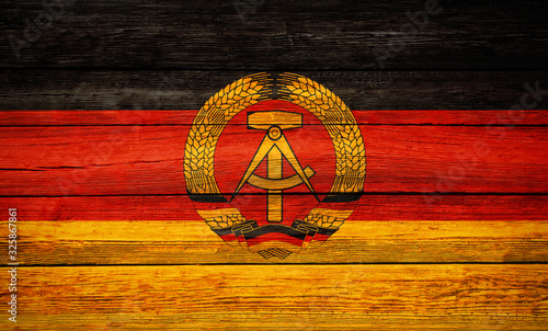 East germany flag wooden plank background