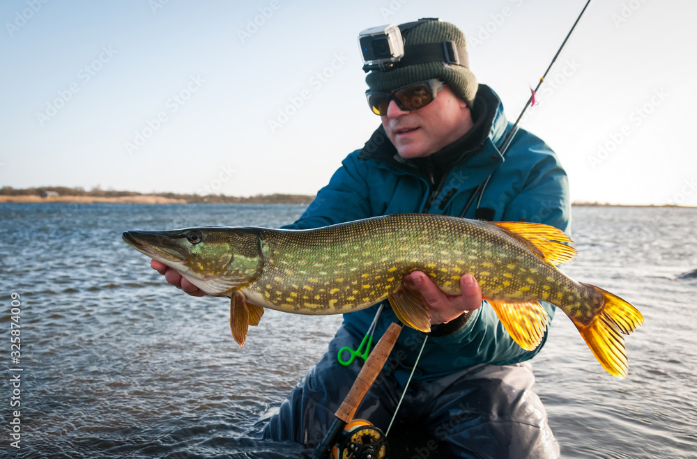 Pike winter fly fishing on Swedish sea coast Pike winter fly fishing on Swedish sea coast