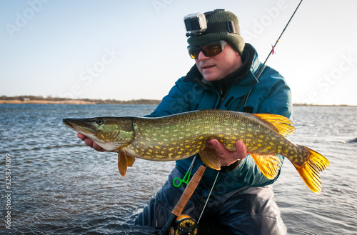 Pike winter fly fishing on Swedish sea coast