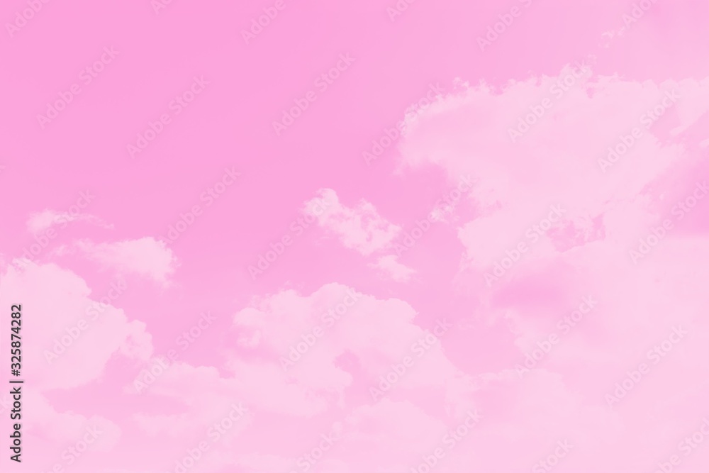 Pink sky background with soft delicate clouds. Copy space