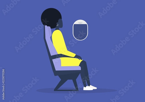 Young black female passenger sitting on board an airplane, travel concept, millennial lifestyle