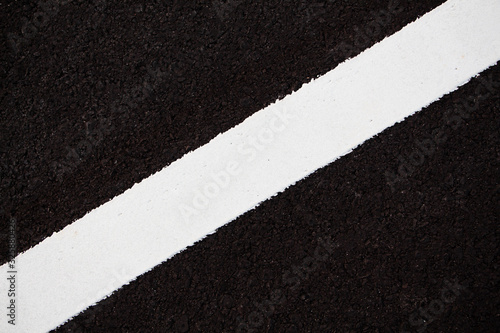 white line on asphalt close up