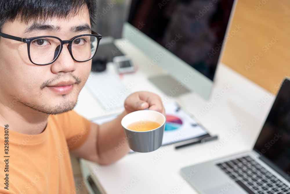 Home office scene of young Asian men Home office scene of young Asian men