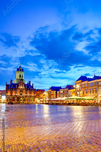 Stadhuis (Known as City Hall) at Local Markt Square (Market Place) in Dutch Old City Delft during Blue Hour, in Holland, the Netherlands.
