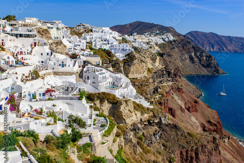 Traditional white buildings facing Aegean Sea in Oia, Santorini island, Greece