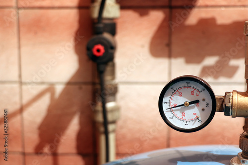 A gauge, manometer, gage on a bright background. photo