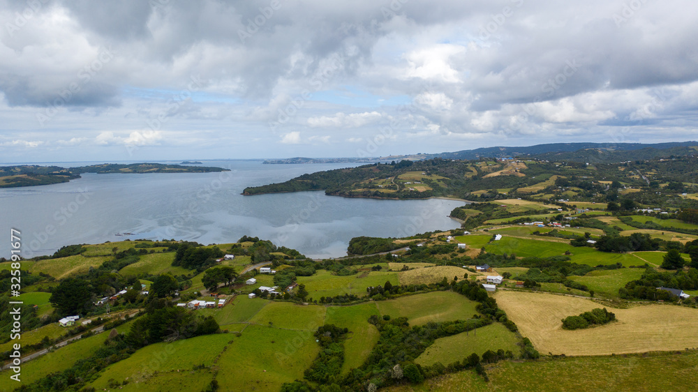 Aerial view of a bay with small islands and farms at Chiloe, Chile Aerial view of a bay with small islands and farms at Chiloe, Chile