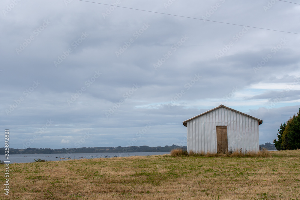 A small warehouse on a farm at Chiloe Island, Chile A small warehouse on a farm at Chiloe Island, Chile