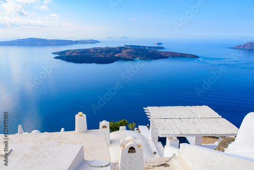 White buildings and hotels with panoramic view of Aegean Sea in Fira, Santorini, Greece