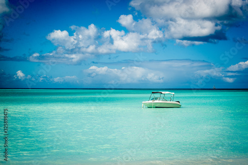 boat on blue water © Rachel