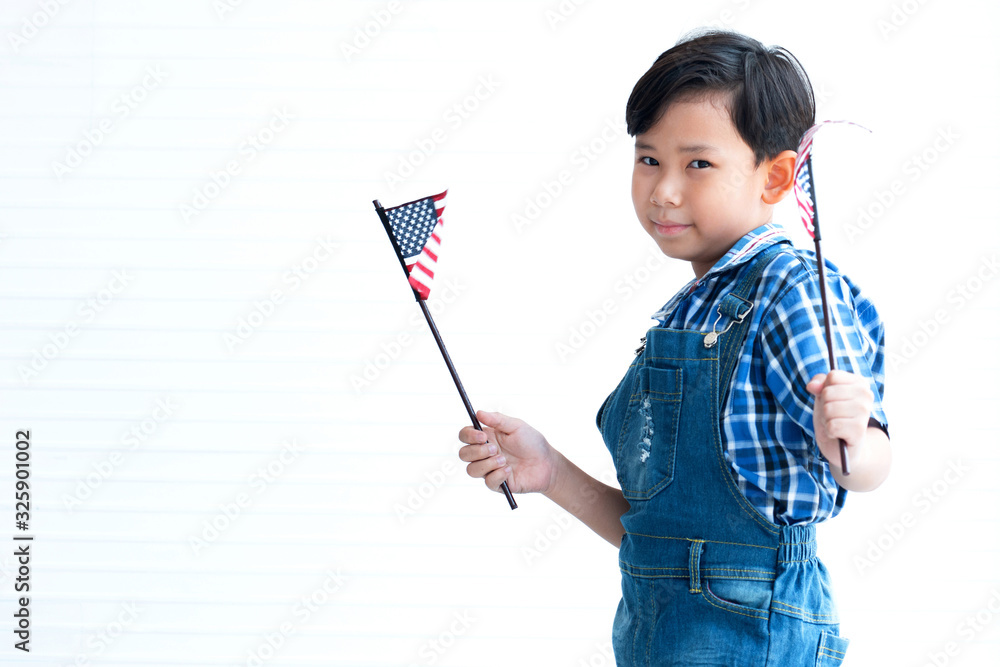 Portrait of cute Asian little boy with American flag on white background, Independence day concept, 4th July Portrait of cute Asian little boy with American flag on white background, Independence day concept, 4th July