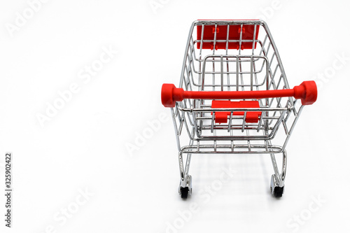 An empty shopping cart isolated on white background. A cart is a vehicle designed for transport for carring something.
