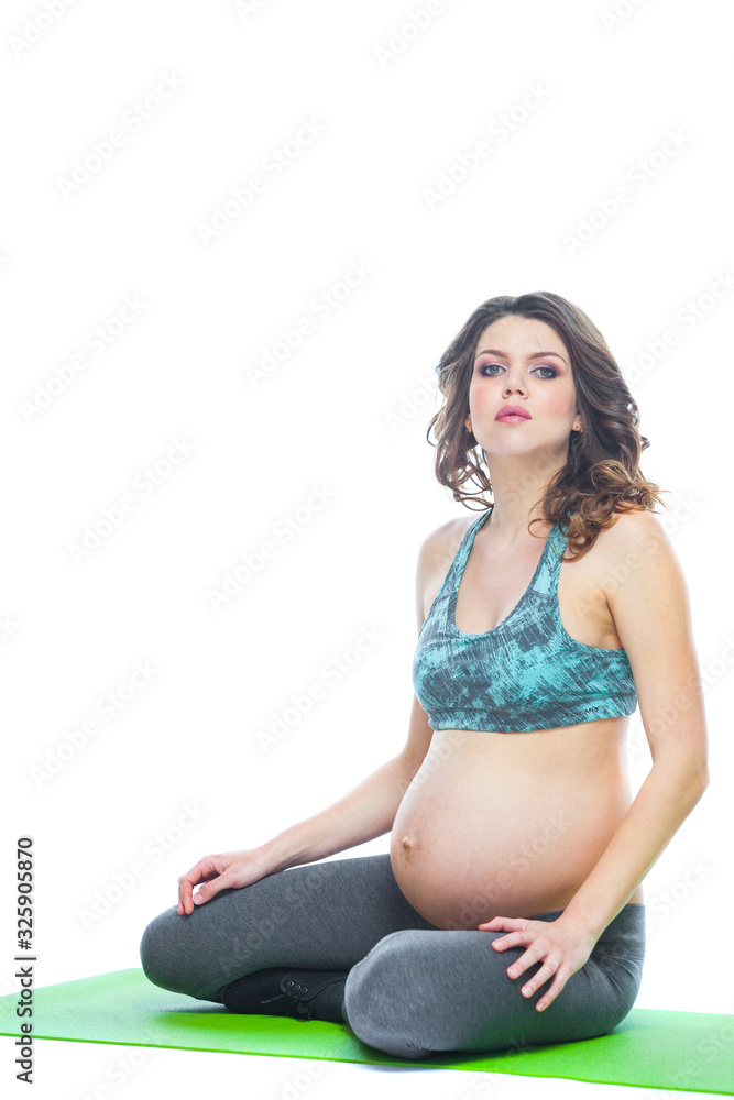Beautiful pregnant woman workout. Doing fitness on last months of pregnancy. Yoga positions. Motherhood, pregnancy, yoga concept. Isolated white background. Beautiful pregnant woman workout. Doing fitness on last months of pregnancy. Yoga positions. Motherhood, pregnancy, yoga concept. Isolated white background.