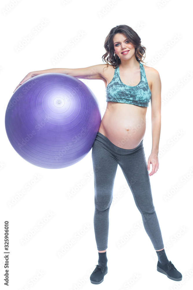 Portrait of a beautiful young pregnant woman exercises with fitball. Working out and fitness, pregnancy concept. Isolated white background.