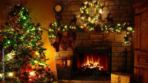 Fascinating 4k shot of firewood flame burning fireplace loop in cosy lovely Christmas tree New Year decoration Noel room