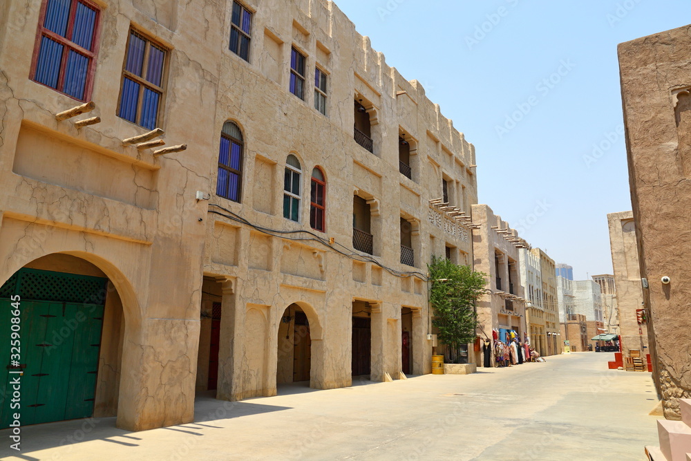 Old Dubai of buildings and traditional Arabian streets. Historical Al Fahidi neighborhood, Al Bastakiya in in Dubai.