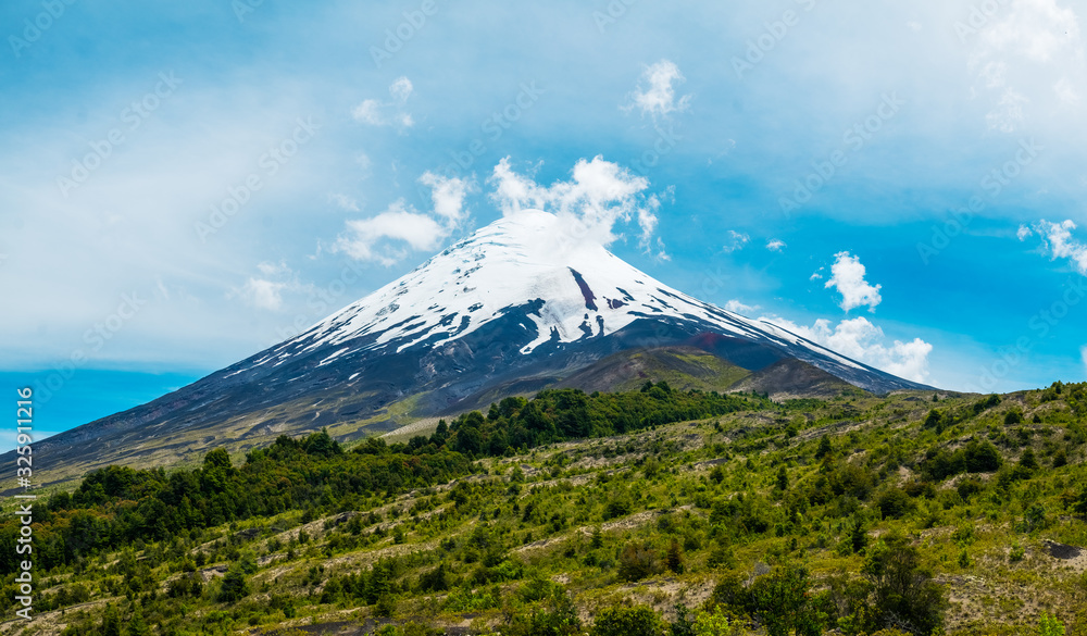 Snow capped volcano of Osorno and lush forest in Chilean Patagonia Snow capped volcano of Osorno and lush forest in Chilean Patagonia