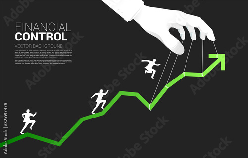 Silhouette of businessman running on graph controlling by Puppet Master. Concept of manipulation and market control.