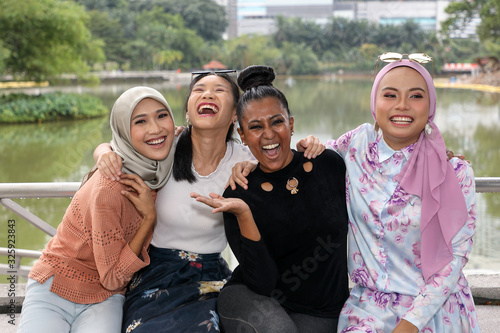 Group of woman Malay Chinese Indian Asian outdoor green park lake nature happy laugh smile mingle