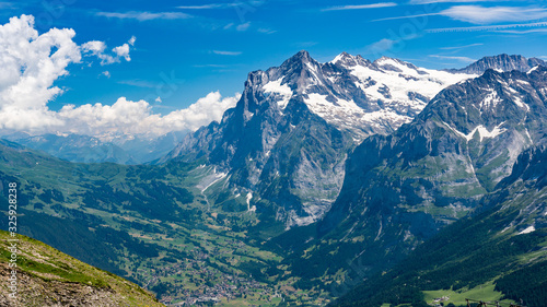 Switzerland, Panoramic view on Grindelwald valley and Wetterhorn and green Alps around