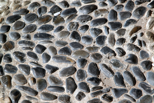 Stone paving background - granite cobblestone pattern in Pattay, Thailand.. photo